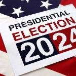 Presidential Election 2024 sign on American flag background.