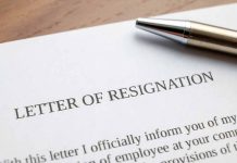 Resignation letter with a pen on top.