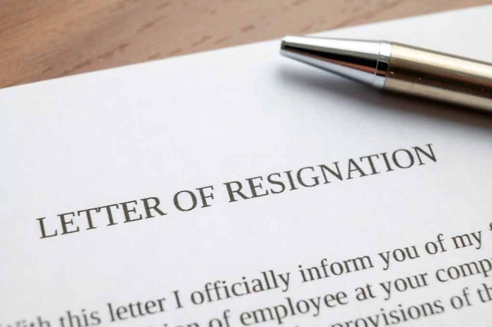 Resignation letter with a pen on top.