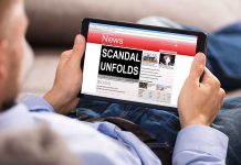 Person reading tablet with headline "Scandal Unfolds".