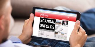 Person reading tablet with headline "Scandal Unfolds".