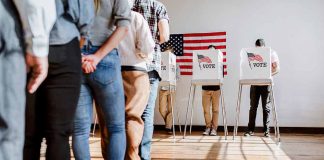 People in line at voting booths.