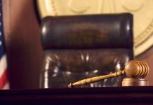 Judge's gavel and chair in court room.