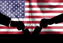 Silhouette handshake over United States flag background.