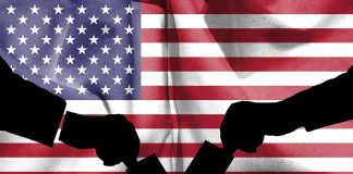 Silhouette handshake over United States flag background.