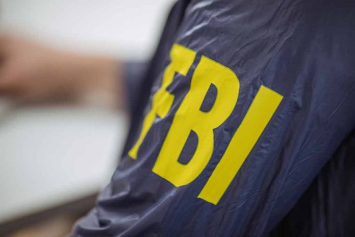 Person wearing jacket with "FBI" in yellow letters.