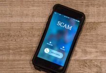 Phone call labeled scam on screen