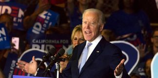 Man speaking at Biden campaign rally