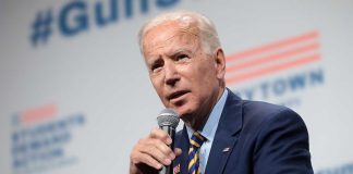 Man speaking into microphone at an event