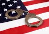 Handcuffs on an American flag.