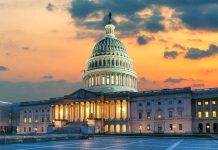 Capitol building at sunset with cloudy sky