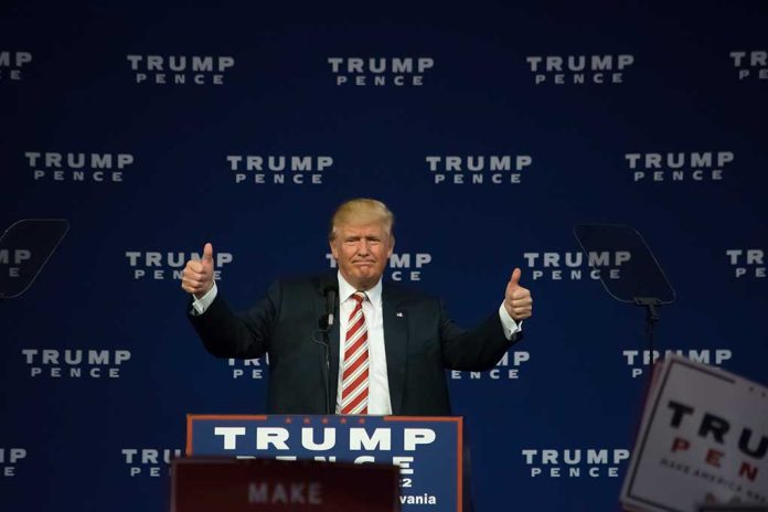 Person giving thumbs up at political event stage