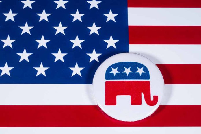 Republican elephant button on American flag background.