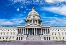 U.S. Capitol building with clear blue sky background.