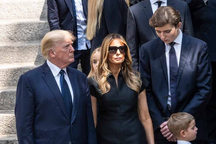 People standing together outdoors in formal attire.