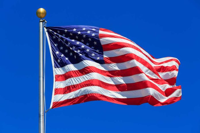 United States flag waving against blue sky