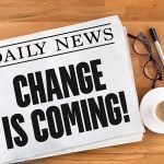 Newspaper headline: "Change is coming!" with coffee.