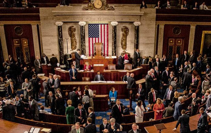 People gathering in United States legislative chamber meeting room