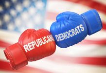 Red and blue boxing gloves with political party names.