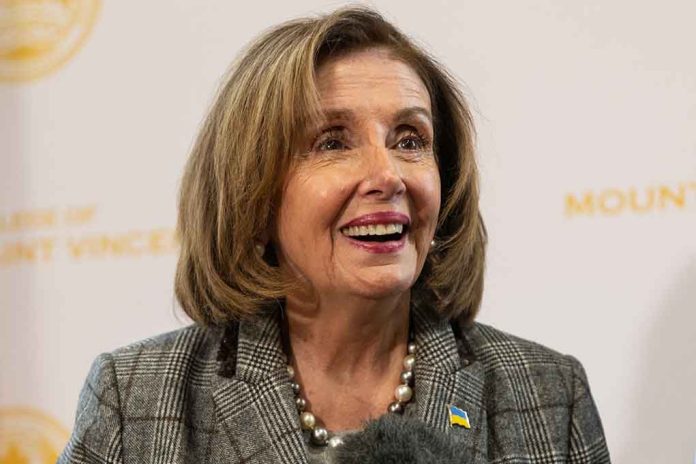 Smiling woman in plaid blazer with pearl necklace.