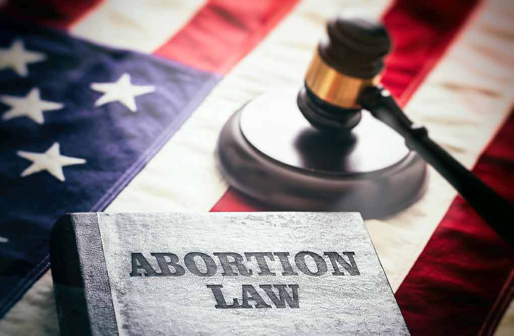 Abortion law book gavel and American flag