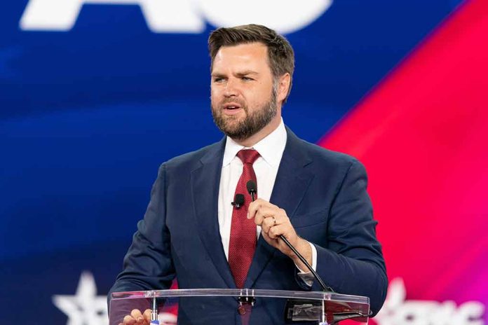 Man in suit speaking at a podium.