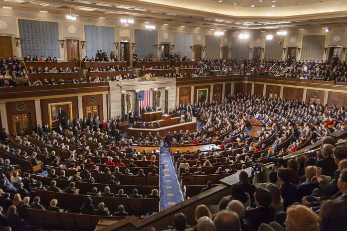 Large audience seated in a formal legislative chamber