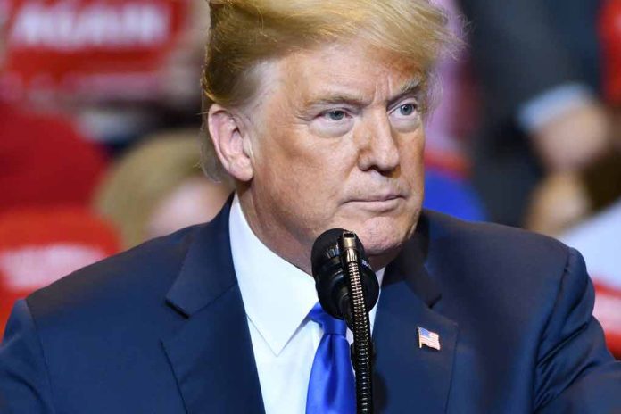 Man speaking at a rally in blue suit