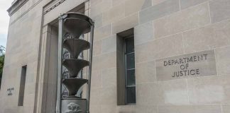 Department of Justice building with stone sculpture.