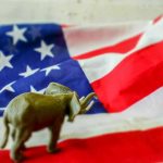 Elephant figurine on an American flag background