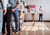 People in line at voting booths