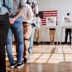 People in line at voting booths