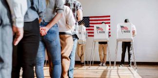 People in line at voting booths