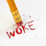 Pencil erasing the word woke in red.