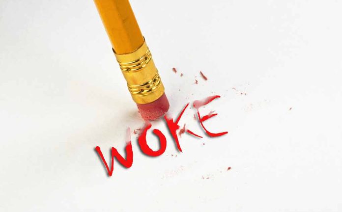 2176573551 featured image Pencil erasing the word woke in red.