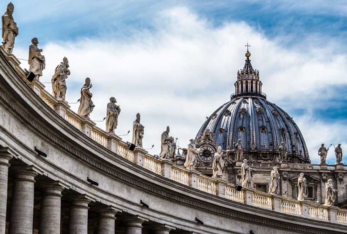368201633 featured image St Peter Basilica dome with statues and clouds