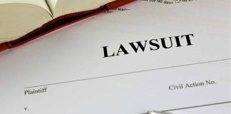 Lawsuit document with pen and open book