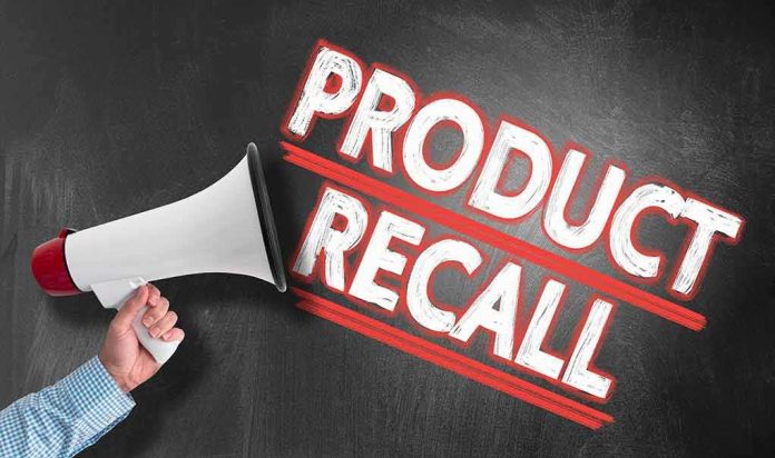 Person holding megaphone Product Recall text