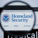 Magnifying glass showing Homeland Security website