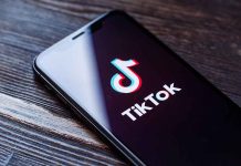 Phone screen showing TikTok logo and app