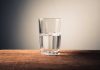Glass of water on wooden surface