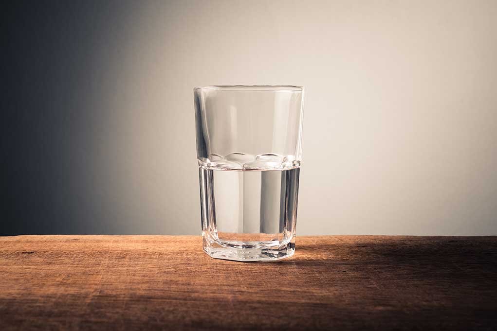 Glass of water on wooden surface
