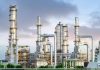 Industrial plant with metal towers and pipes