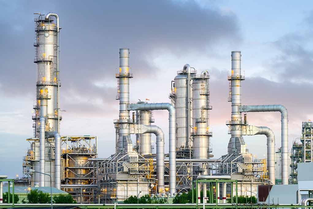 Industrial plant with metal towers and pipes