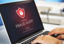 Laptop displaying fraud alert warning on screen