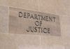 Department of Justice sign on a building