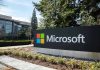 Microsoft sign with office buildings and trees