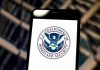 U.S. Department of Homeland Security logo on smartphone