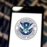 U.S. Department of Homeland Security logo on smartphone