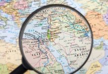 Magnifying glass over the Middle East and Egypt
